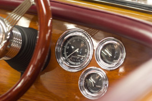 A close up picture of a boat dash with gauges